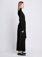 Side full length image of model wearing Meret Dress in BLACK