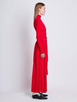 Side full length image of model wearing Meret Dress in RED