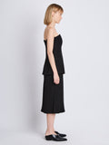 Side full length image of model wearing Diane Skirt in BLACK
