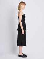 Side full length image of model wearing Diane Skirt in BLACK