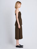 Side full length image of model wearing Diane Skirt in DARK LODEN