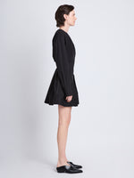 Side full length image of model wearing Eileen Dress in BLACK