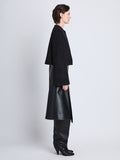 Side full length image of model wearing Brigdet Cropped Jacket with Leather Collar in BLACK
