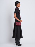 Image of model wearing Small Beacon Bag in GARNET