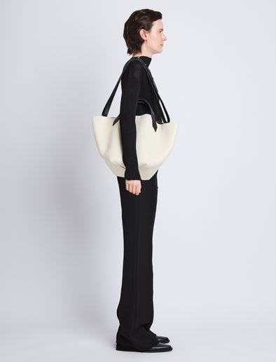  image of model wearing Large Chelsea Tote in ivory/black