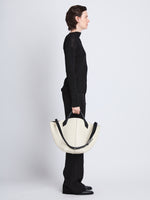  image of model wearing Large Chelsea Tote in ivory/black