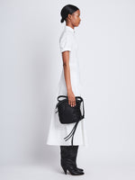 Image of model wearing Nylon Drawstring Pouch in BLACK
