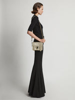 Image of model wearing PS1 Mini Crossbody Bag in CEMENT