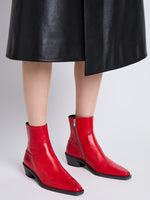 Image of model wearing Bronco Ankle Boots in RED