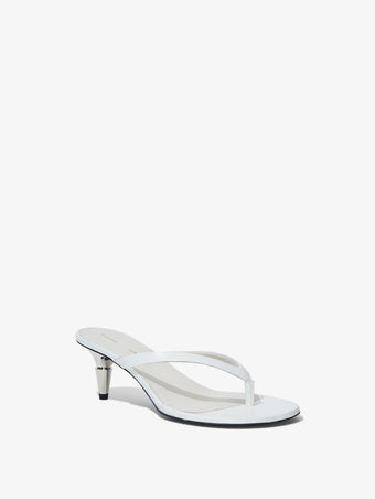 3/4 Front image of Spike Flip Flops in CREAM
