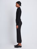 Side image of model wearing Marlene Pant in Tropical Wool in black