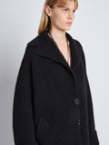 Detail image of model wearing Ruth Coat In Knit Outerwear in black