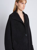 Detail image of model wearing Ruth Coat In Knit Outerwear in black