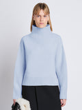 Cropped front image of model wearing Alma Sweater In Lofty Eco Cashmere in pale blue