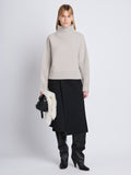 Front image of model wearing Lofty Eco Cashmere Turtleneck Sweater in LIGHT GREY MELANGE