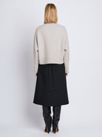 Back image of model wearing Lofty Eco Cashmere Turtleneck Sweater in LIGHT GREY MELANGE