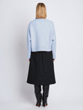 Back image of model wearing Alma Sweater In Lofty Eco Cashmere in pale blue