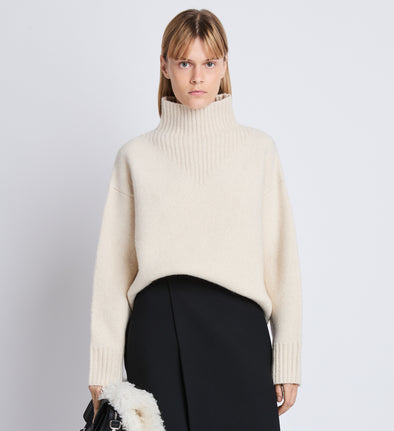 Cropped front image of model wearing Alma Sweater In Lofty Eco Cashmere in ecru