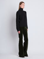 Side image of model wearing Camilla Sweater In Lofty Eco Cashmere in black