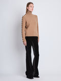 Side image of model wearing Camilla Sweater In Lofty Eco Cashmere in light camel