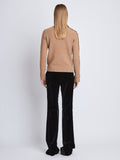 Back image of model wearing Camilla Sweater In Lofty Eco Cashmere in light camel