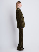 Side image of model wearing Nico Jacket In Velvet Suiting in olive