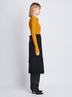 Side image of model wearing Carla Sweater In Midweight Viscose Rib in gold