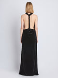 Back image of model wearing Faye Backless Twist Back Dress In Velvet in black