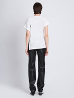 Back full length image of model wearing Hopper T-Shirt in WHITE
