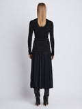 Back full length image of model wearing Agnes Henley Sweater in BLACK