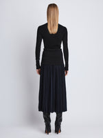 Back full length image of model wearing Agnes Henley Sweater in BLACK