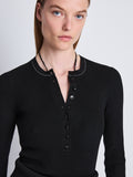 Detail image of model wearing Agnes Henley Sweater in BLACK