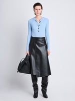 Front full length image of model wearing Agnes Henley Sweater in LIGHT BLUE