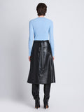 Back full length image of model wearing Agnes Henley Sweater in LIGHT BLUE