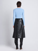 Back full length image of model wearing Agnes Henley Sweater in LIGHT BLUE