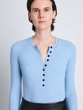 Detail image of model wearing Agnes Henley Sweater in LIGHT BLUE