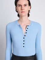 Detail image of model wearing Agnes Henley Sweater in LIGHT BLUE