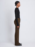 Side full length image of model wearing Barbara Pant In Textured Wool Twill in DARK LODEN