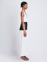 Side full length image of model wearing Viviane Dress in OFF WHITE