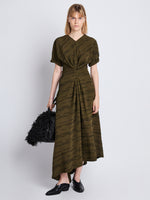 Front full length image of model wearing Vivienne Asymmetrical Dress in OLIVE MULTI