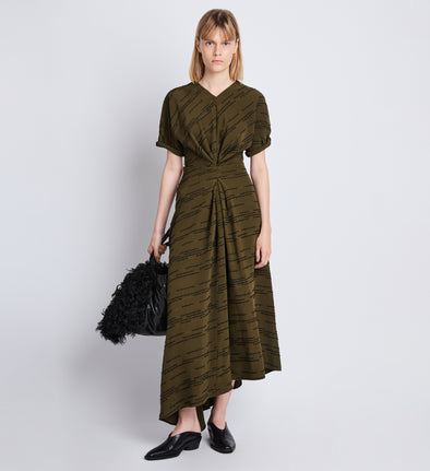 Front full length image of model wearing Vivienne Asymmetrical Dress in OLIVE MULTI
