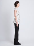 Side full length image of model wearing Stella Top in WHITE MULTI