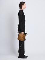 Image of model wearing Nylon Drawstring Pouch in FATIGUE