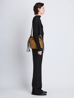 Image of model wearing Nylon Drawstring Pouch in FATIGUE
