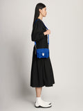 Image of model wearing Suede PS1 Mini Crossbody Bag in ELECTRIC BLUE
