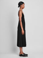 Side image of model wearing Wren Dress In Pleatable Crepe in black