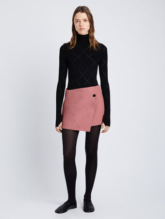 Front image of model in Melton Wool Wrap Skirt in dusty pink melange