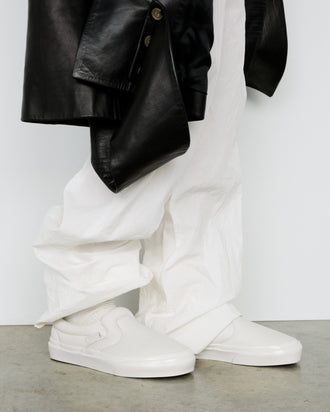 Image of model wearing Vans x Proenza Schouler Puffy Slip-On Shoes in ecru