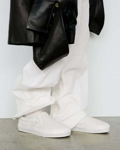 Image of model wearing Vans x Proenza Schouler Puffy Slip-On Shoes in ecru