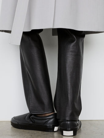 Image of model wearing Vans x Proenza Schouler Puffy Slip-On Shoes in black